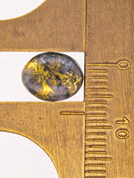2.46ct Oval Black Gold in Quartz Cabochon